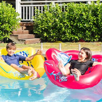 two friends floating on their wahu inflatable chillax chairs