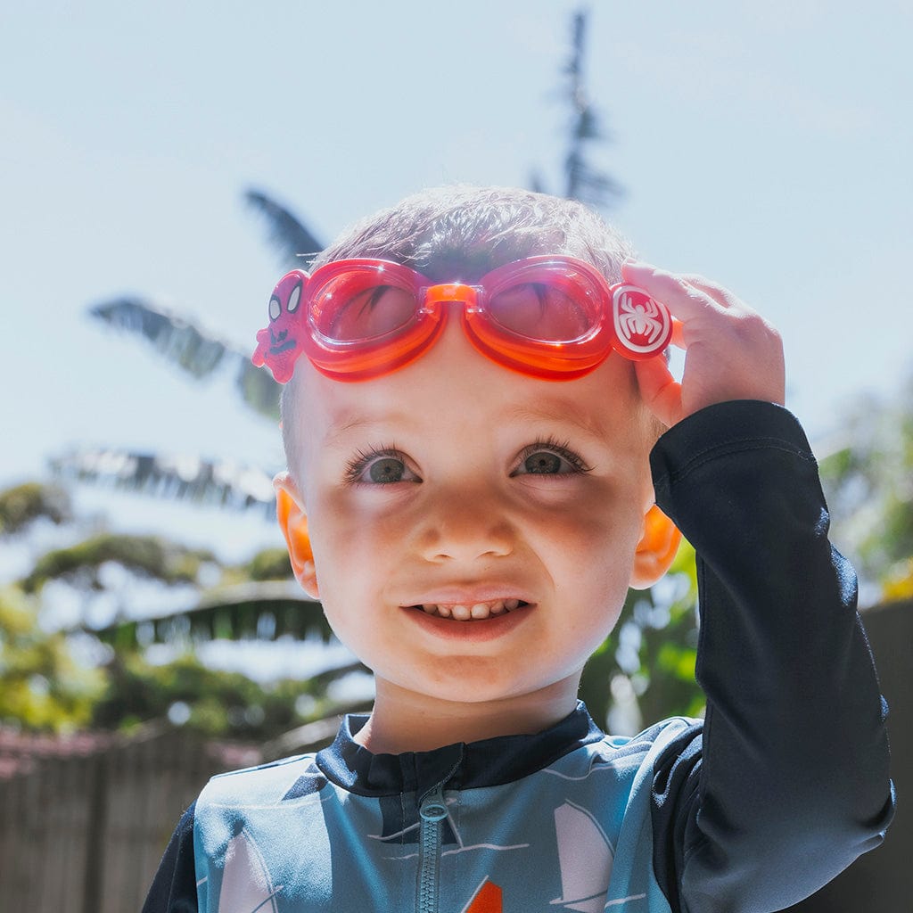 Little boy wearing red Wahu Spider-Man and Friends swim goggles