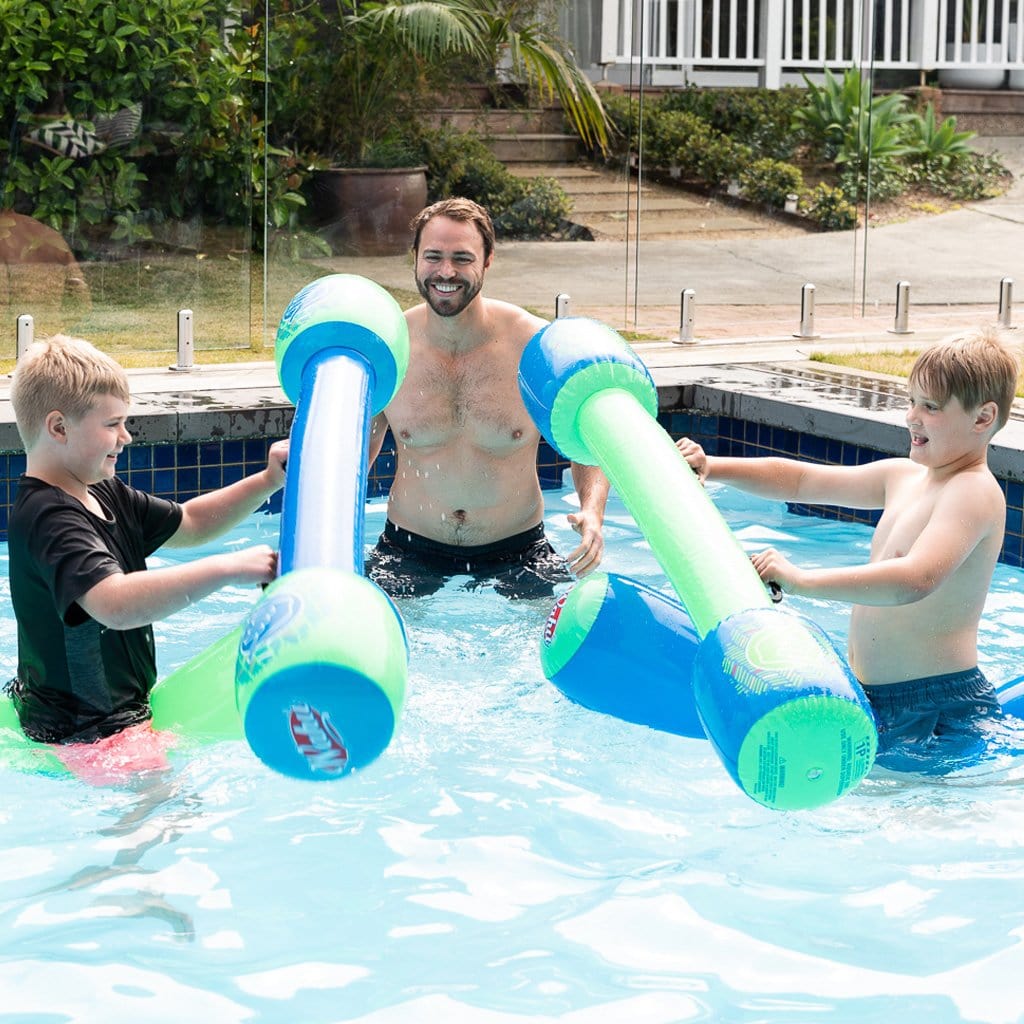Family in pool playing with the Wahu Tube Wars