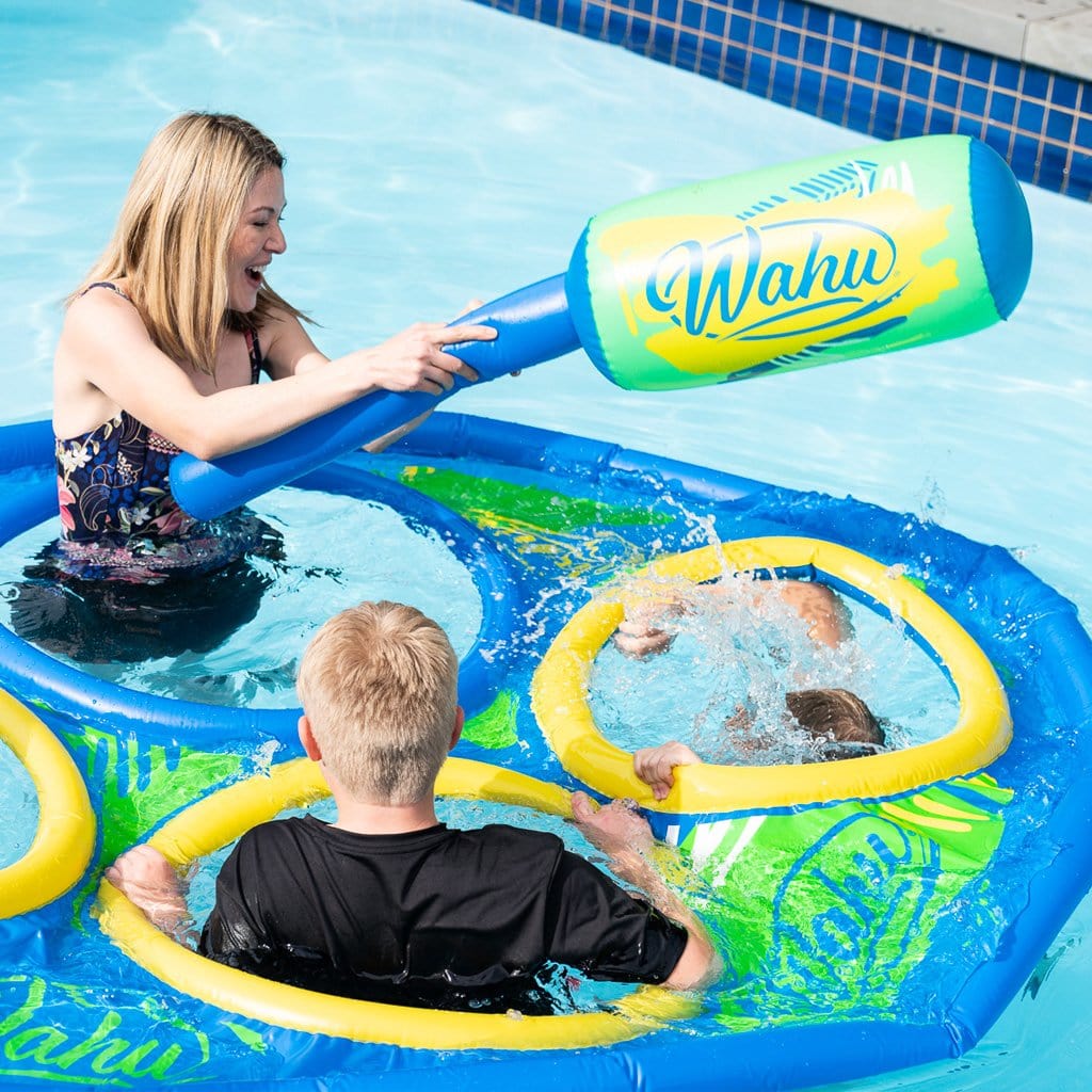 Family in pool playing with the Wahu Pool Bopper