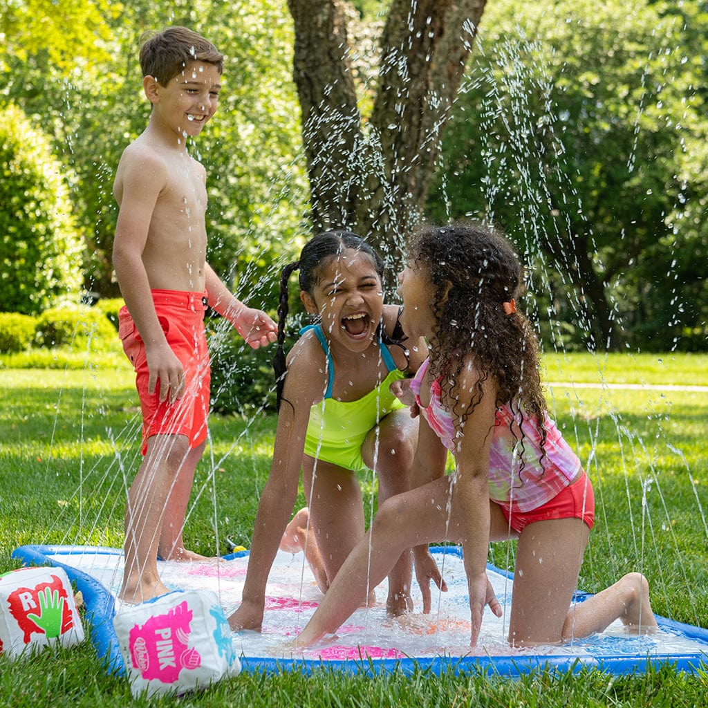 three children playing Wahu Splash &#39;N Tangle in backyard