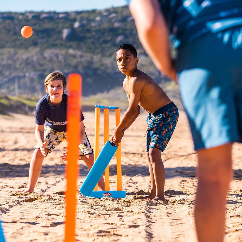 Kids on beach playing Beach Cricket with Wahu Double Cricket Set