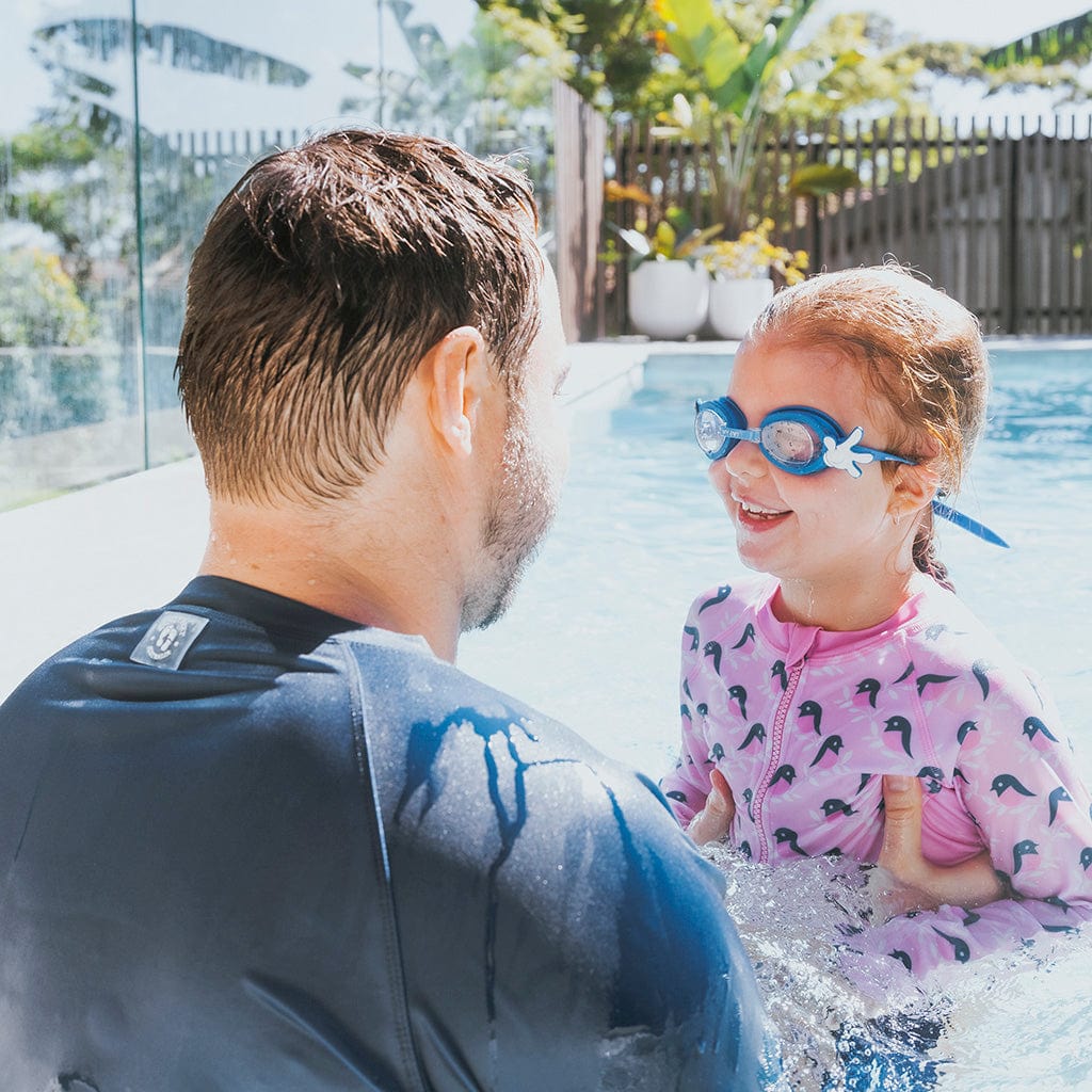 Father and daughter swimming together with girl wearing Wahu Mickey Mouse Swimming Goggles