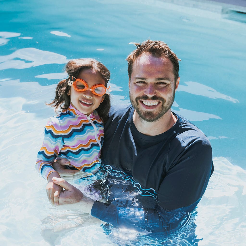 Father and Daughter in pool, daughter wearing Wahu Mickey Mouse Swimming Goggles