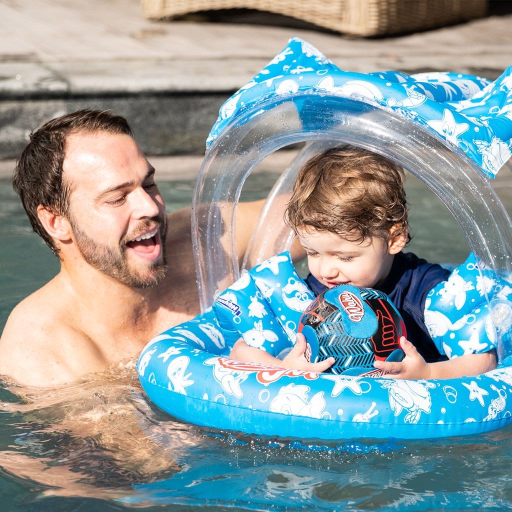 Family in pool with child using the Wahu Junior Ring with Seat &amp; Canopy