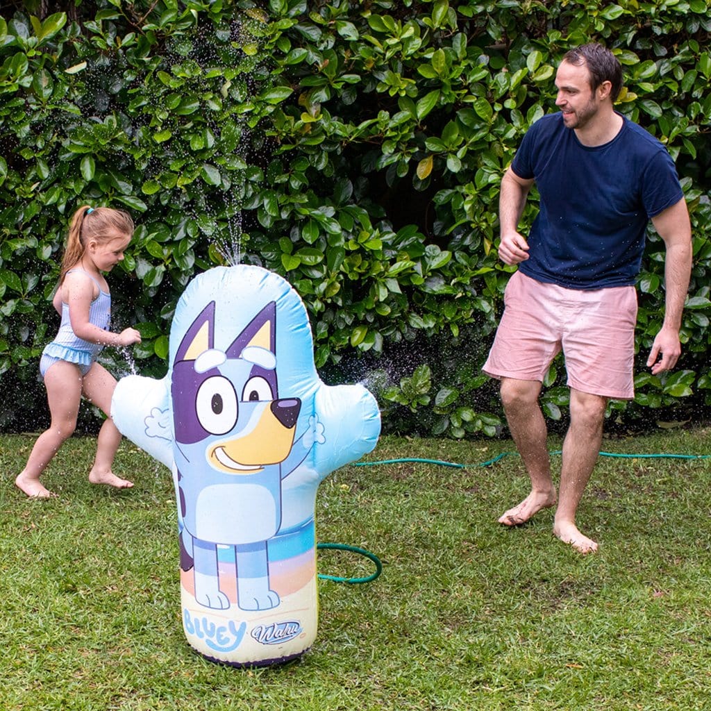 Father and Daughter in backyard playing with the Wahu x Bluey Backyard Splash
