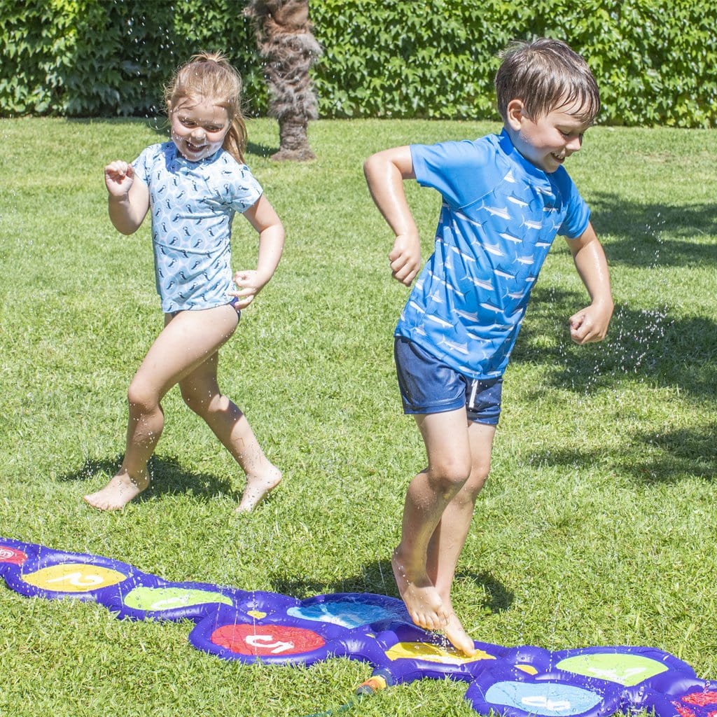 Children in backyard palying with the Wahu Hop Skip &#39;N&#39; Splash
